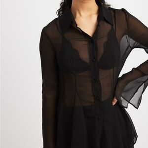 NA-KD black chiffon collared blouse. Buttoned front, fit-and-flare tailoring.